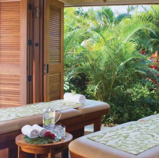 Couple's massage on the beach by Hyatt Spas