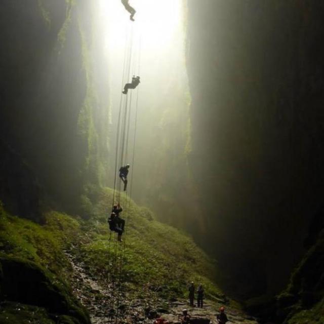 Baby rappelling in caves in Waitomo