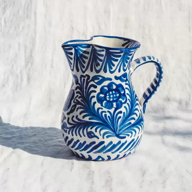 Medium pitcher with hand painted designs in Blue