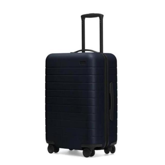 Away Suitcase "The Bigger Carry-On" with Battery in Navy