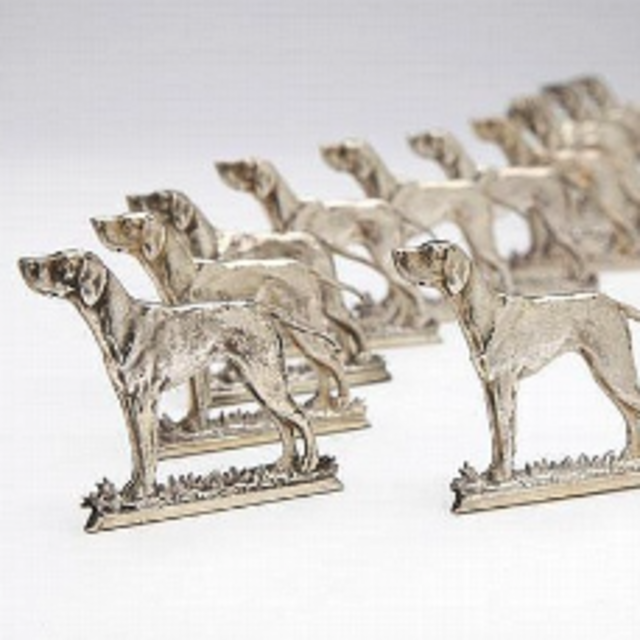 A set of twelve Silver dog-form place card holders