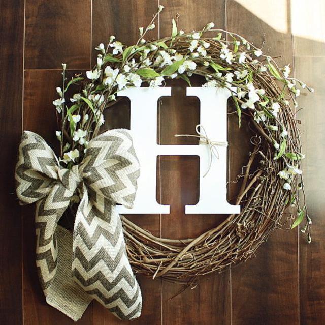 Monogrammed Grapevine Wreath with white cherry blossom details intertwined & a Chevron Bow