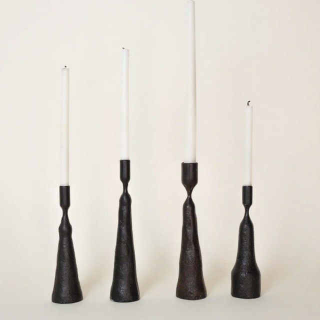 Set of four iron candlesticks