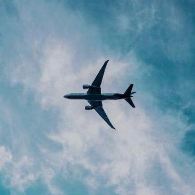 Round trip air fare from Dallas to Anchorage