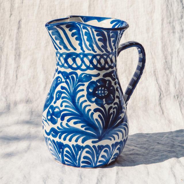 Large pitcher with hand painted designs