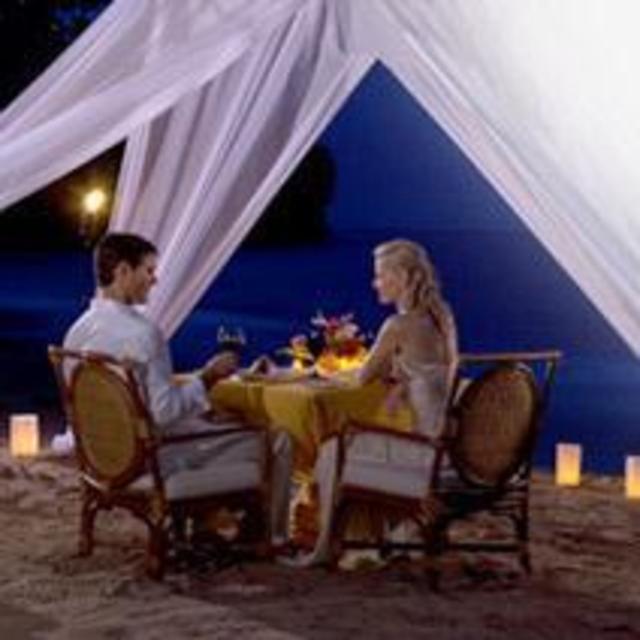 Beachside romantic candlelight dinner