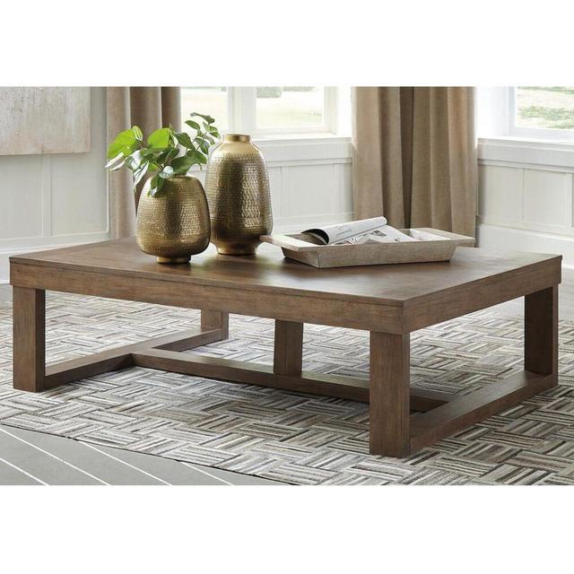 Signature Design by Ashley Cariton Cocktail Table in Grayish Brown