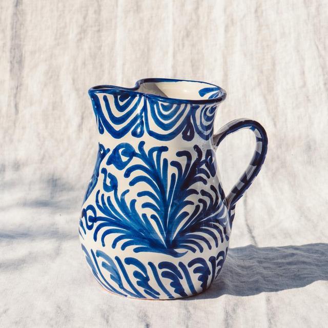 Small pitcher with hand painted designs