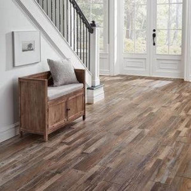 Replace den carpet with vinyl flooring