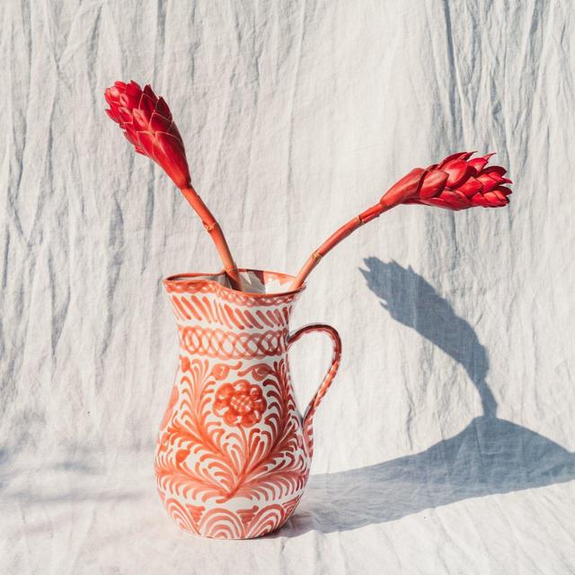 Large pitcher with hand painted designs