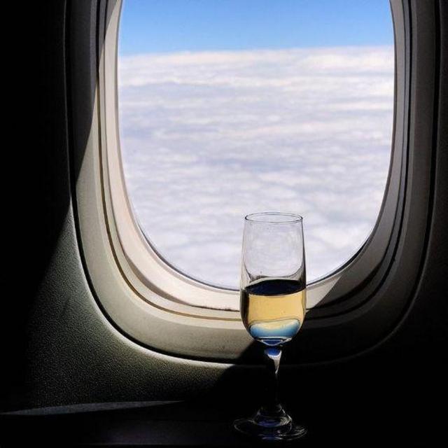 First drink of our honeymoon (in the sky!)