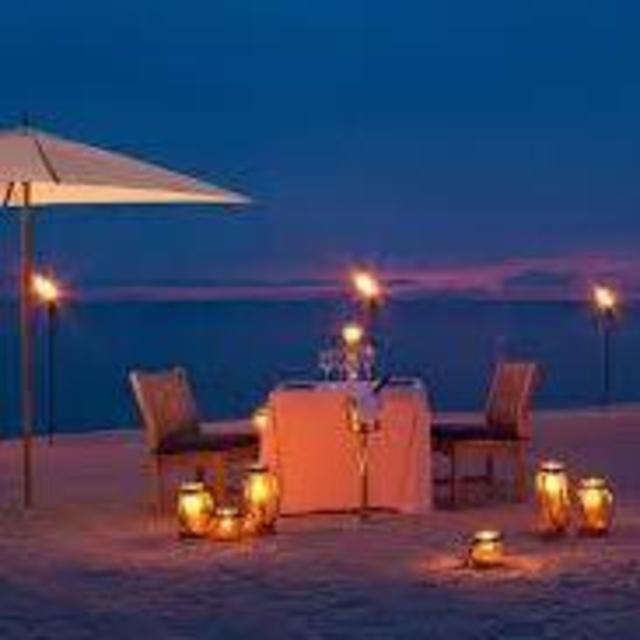 Candlelit Dinner on the beach on our Honeymoon!