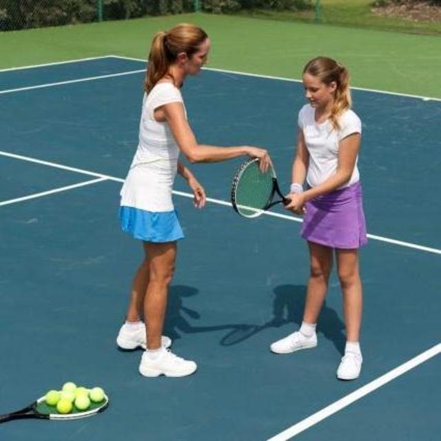 Tennis Lessons so Leah can keep up with Michael