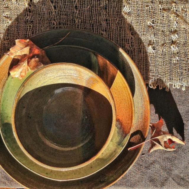 Sage green and brown place settings for four